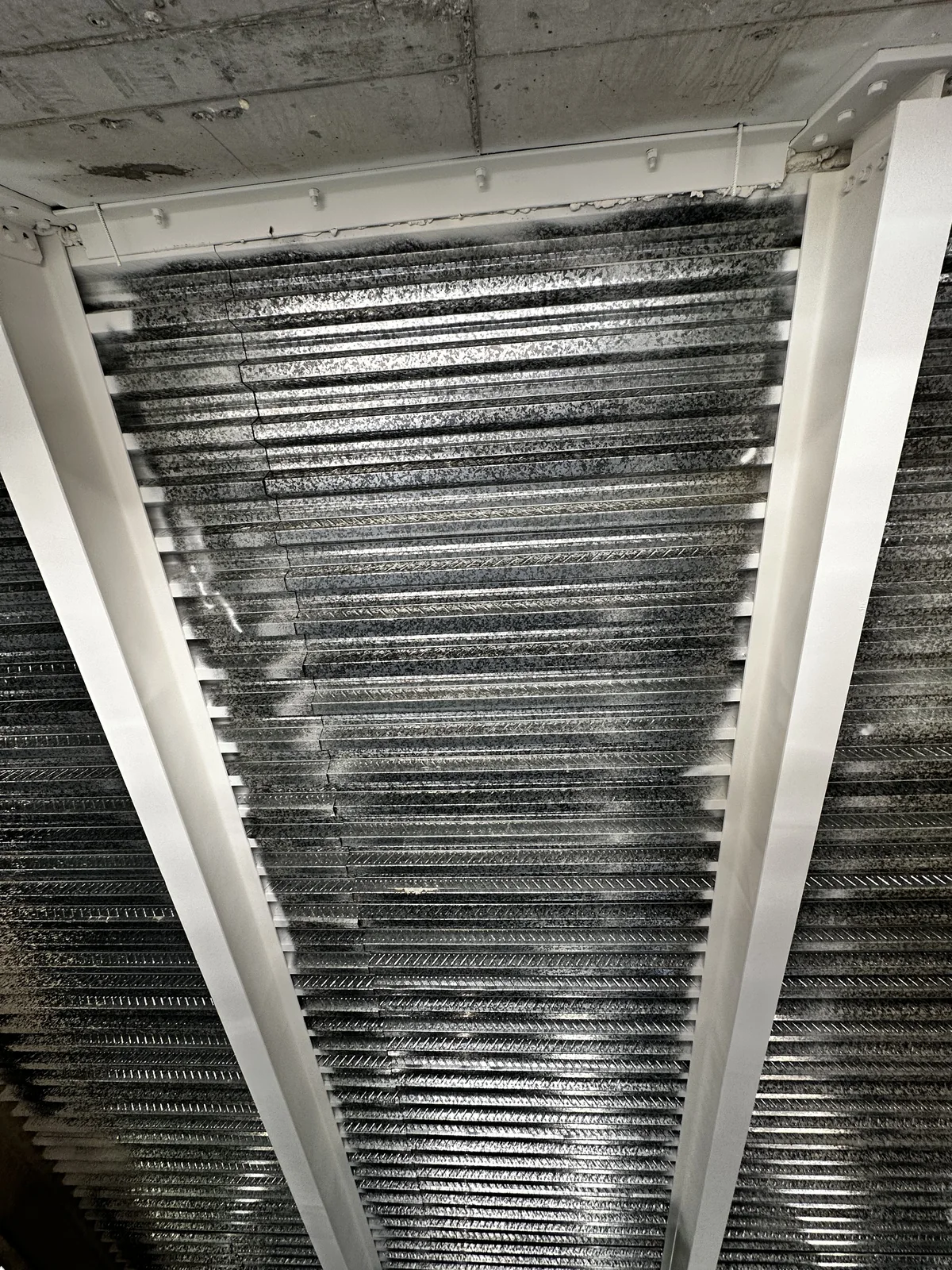 Coated beam detail beneath the ceiling — Center of Excellence