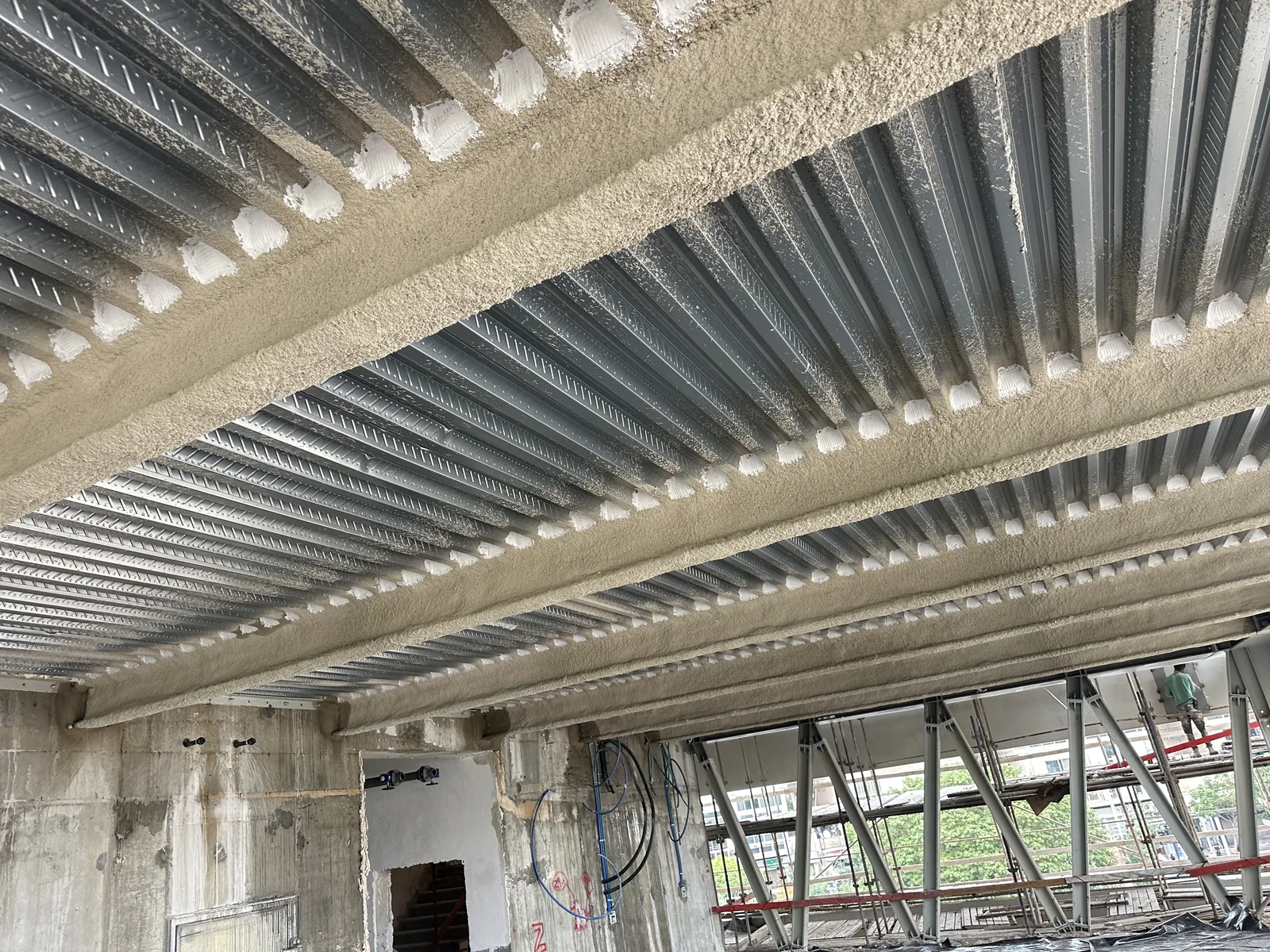 Cementitious protection on ceiling beams — Kikar Hamedina School